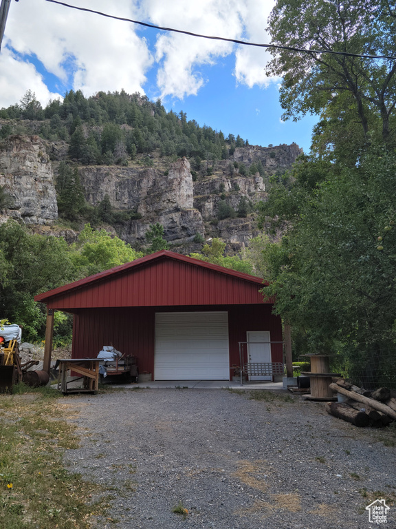 Detached garage with gravel driveway