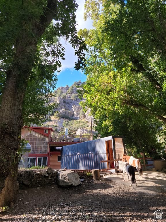 Back of property featuring a mountain view