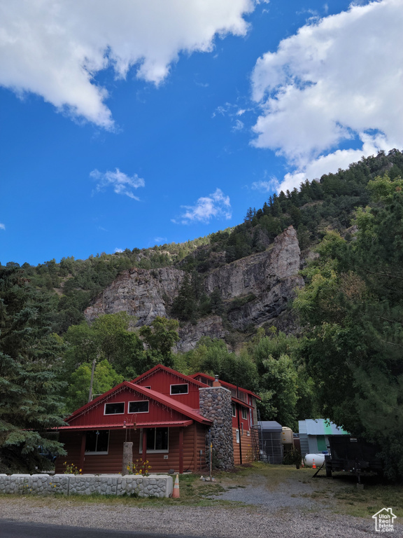 View of mountain backdrop with a heavily wooded area