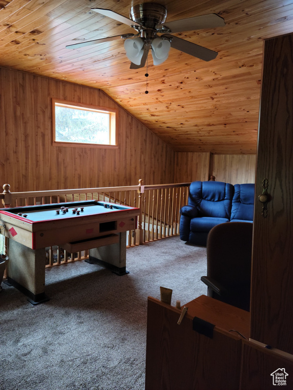 Game room featuring wooden ceiling, ceiling fan, wood walls, lofted ceiling, and carpet