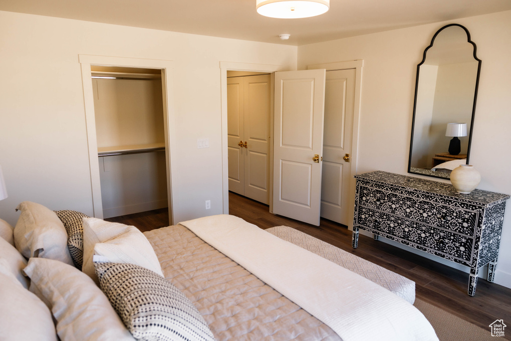 Bedroom featuring wood finished floors and a closet