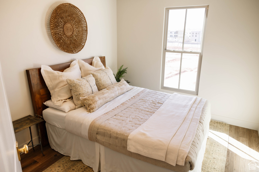 Bedroom with wood finished floors