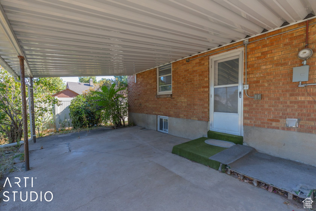 View of patio featuring an attached carport