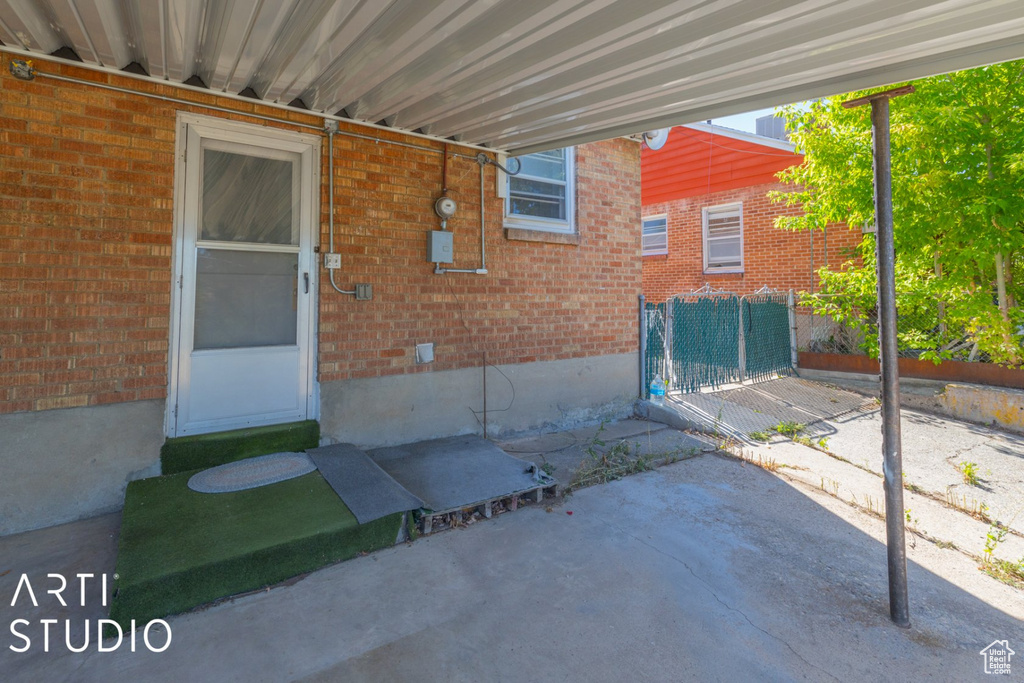 View of patio featuring an attached carport