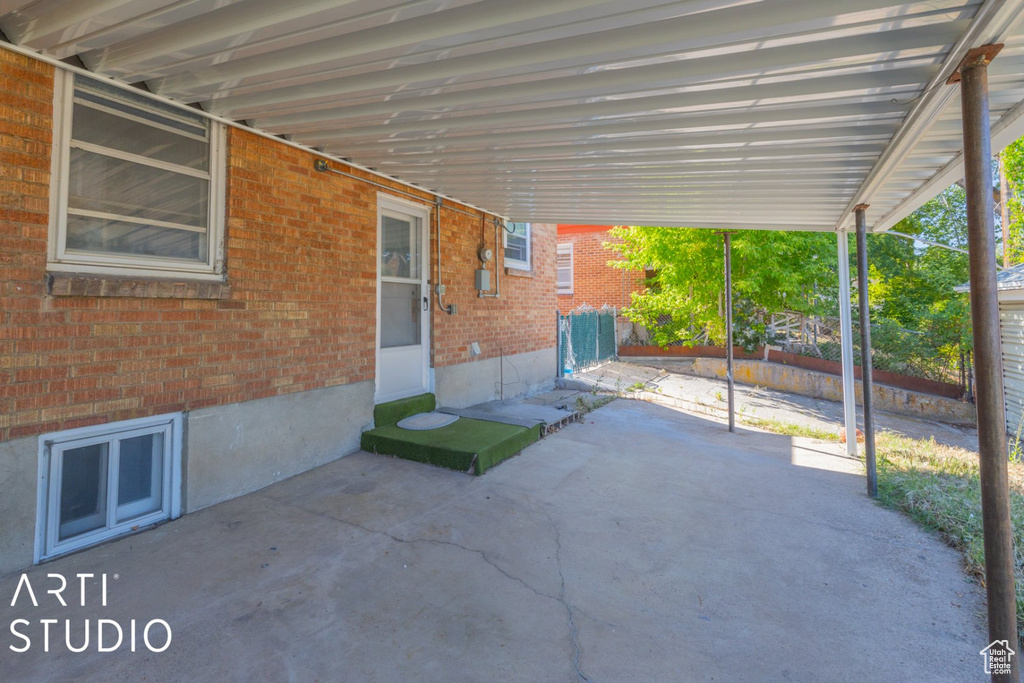 View of patio / terrace featuring an attached carport
