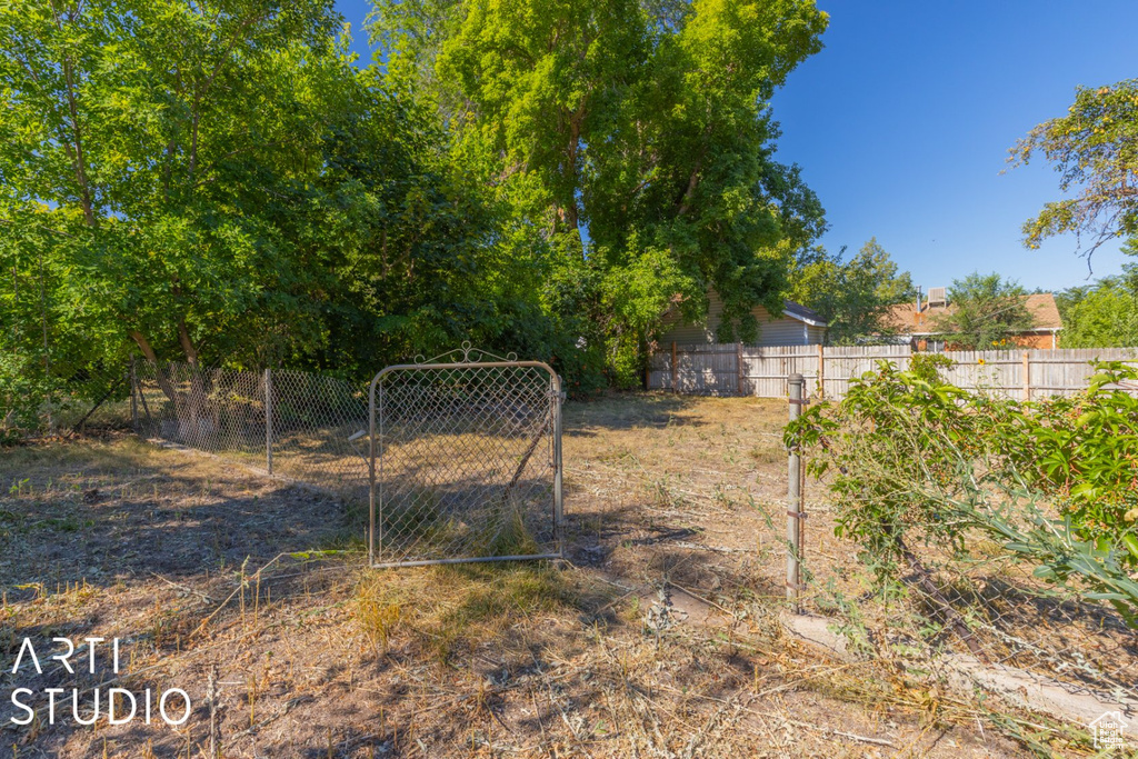 View of yard with a gate