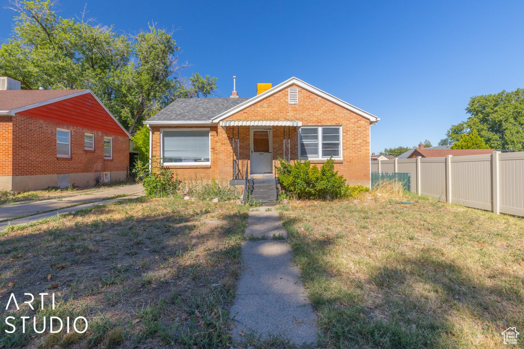 Bungalow with brick siding