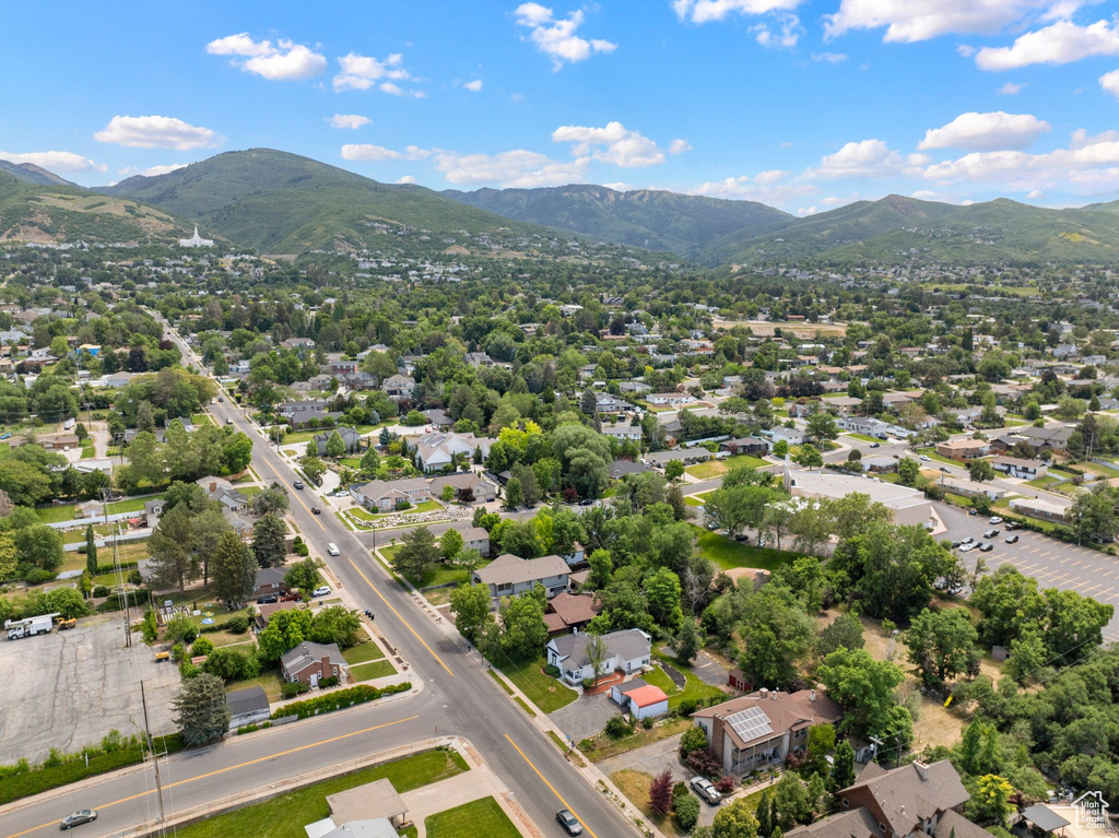 Aerial view of residential area featuring a mountainous background