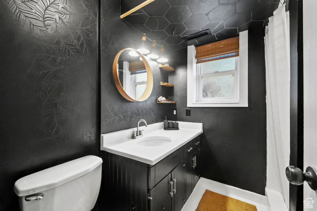 Full bathroom featuring vanity and a shower with curtain