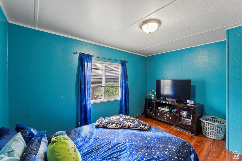 Bedroom with wood finished floors