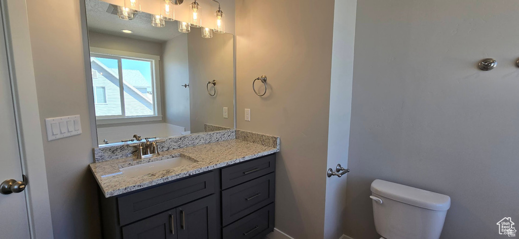 Half bath with toilet and vanity