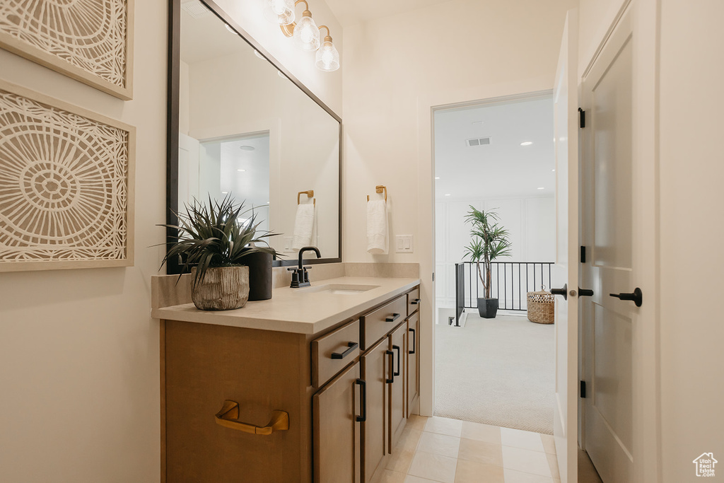 Bathroom with vanity and tile patterned flooring