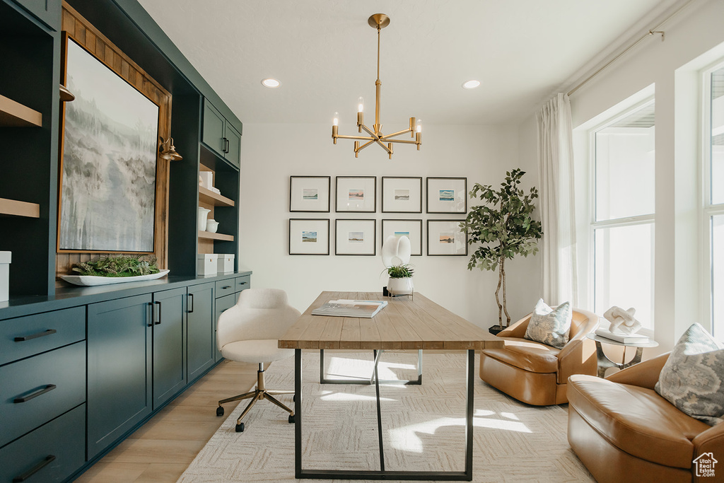 Office with a chandelier, light wood-style floors, and recessed lighting