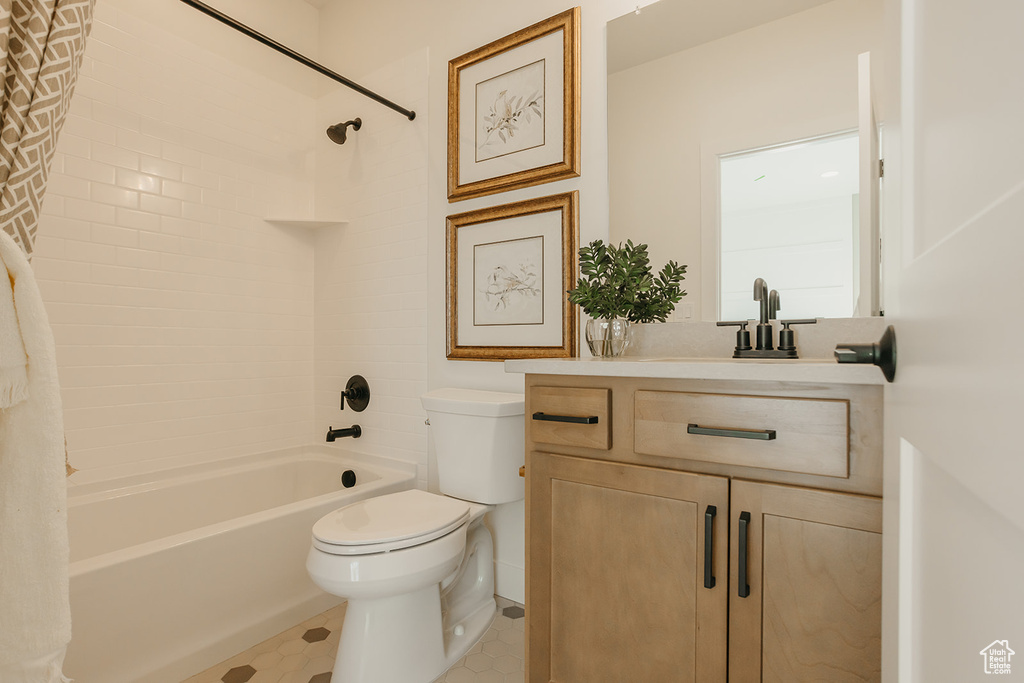 Full bath featuring shower / tub combo with curtain and vanity