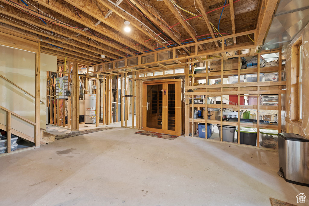 Unfinished basement with strapped water heater