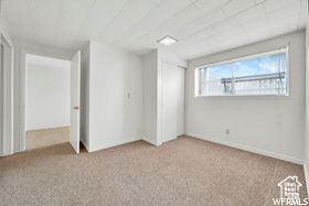 Unfurnished bedroom with carpet floors