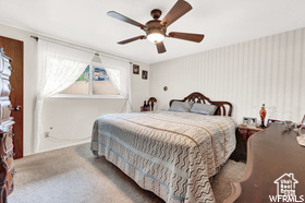 Bedroom featuring carpet floors and ceiling fan
