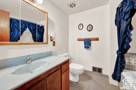 Full bathroom featuring vanity and a tub to relax in