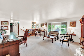 Living area featuring carpet