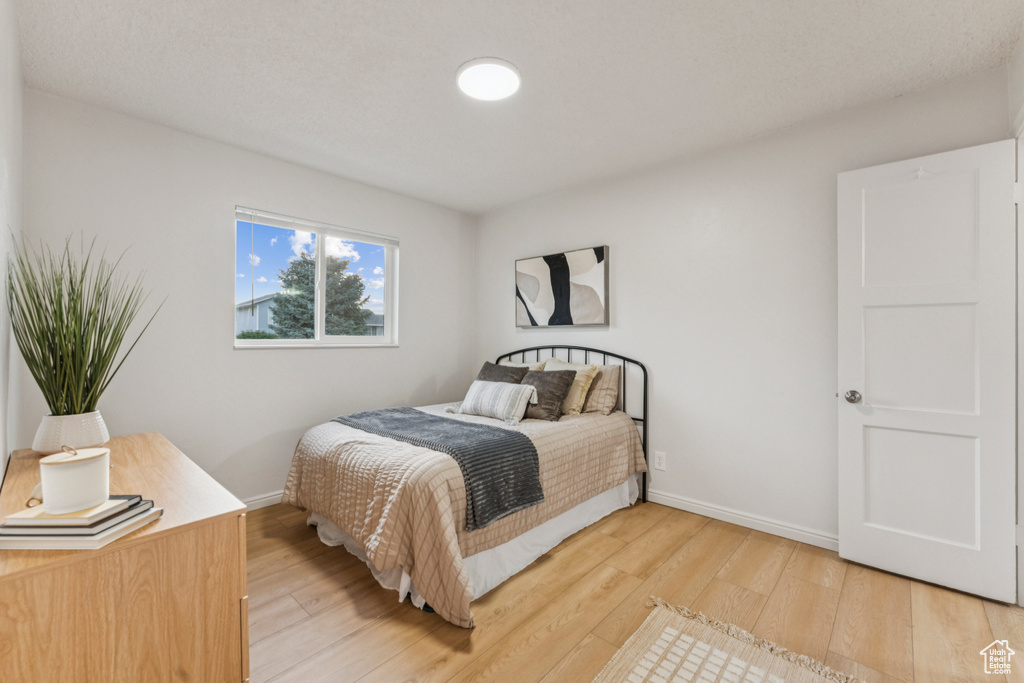 Bedroom with light wood-type flooring