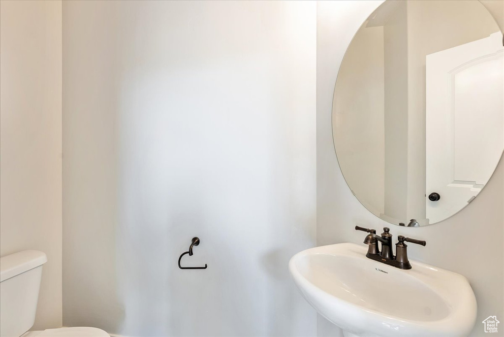 Bathroom featuring a sink and toilet