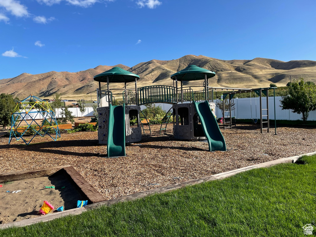Community jungle gym with a mountain view