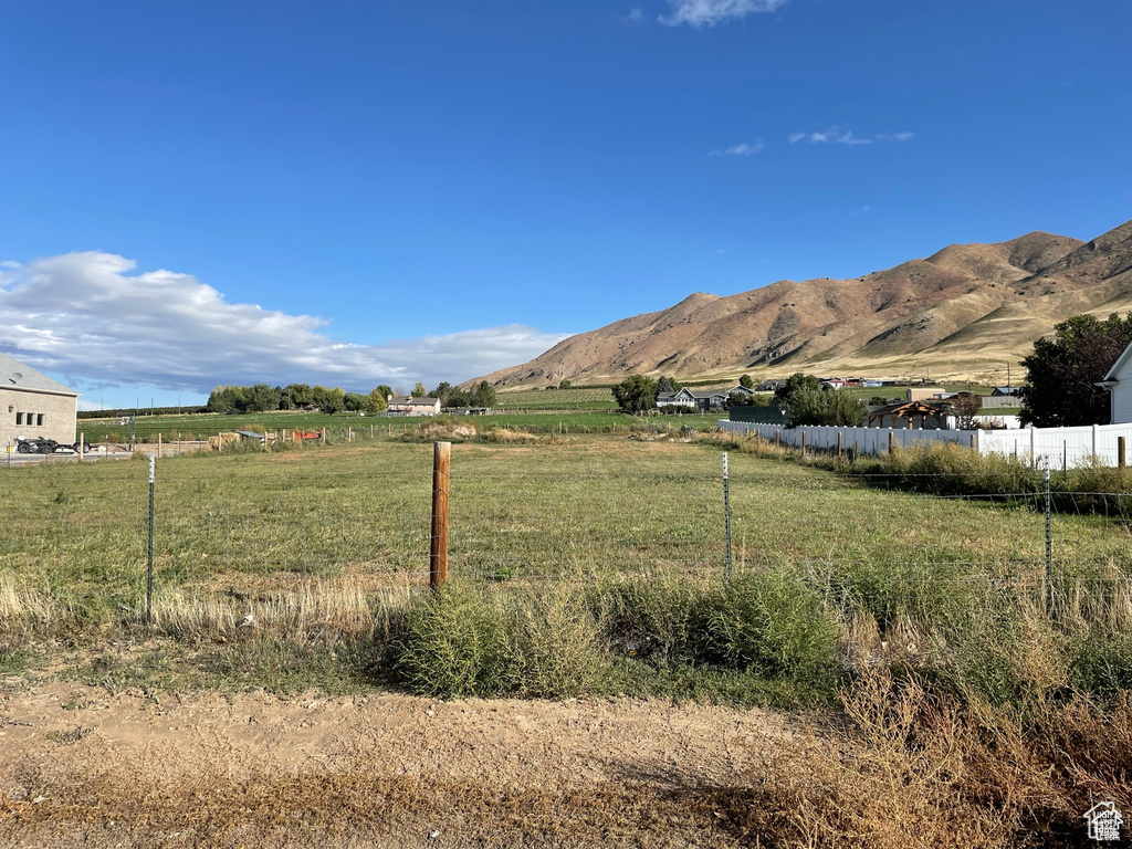 View of mountain backdrop with rural landscape