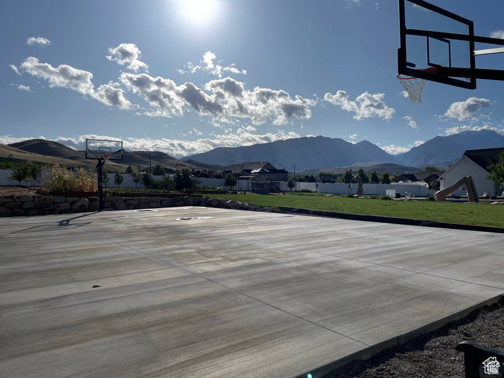 View of sport court with community basketball court and a mountain view