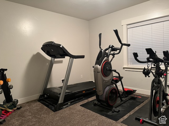 Workout area featuring baseboards
