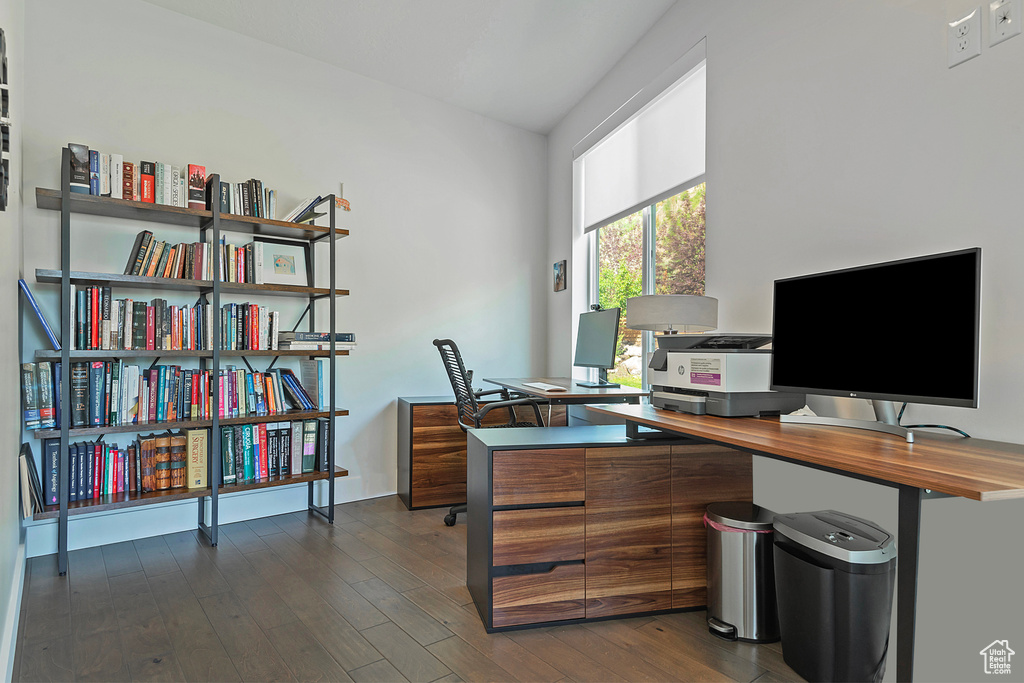 Office space with dark wood finished floors