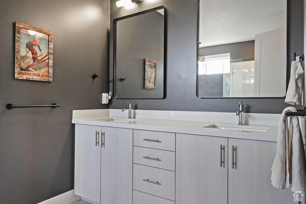 Bathroom featuring double vanity