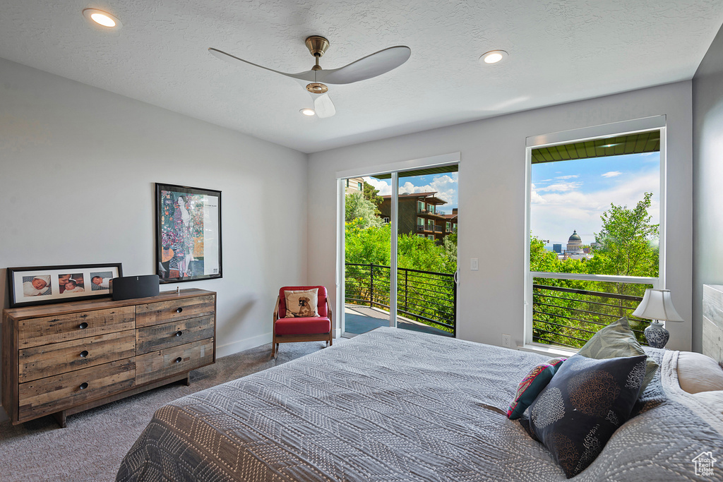 Carpeted bedroom featuring access to outside, recessed lighting, and ceiling fan