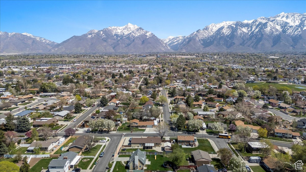 View of property location featuring a mountainous background and nearby suburban area