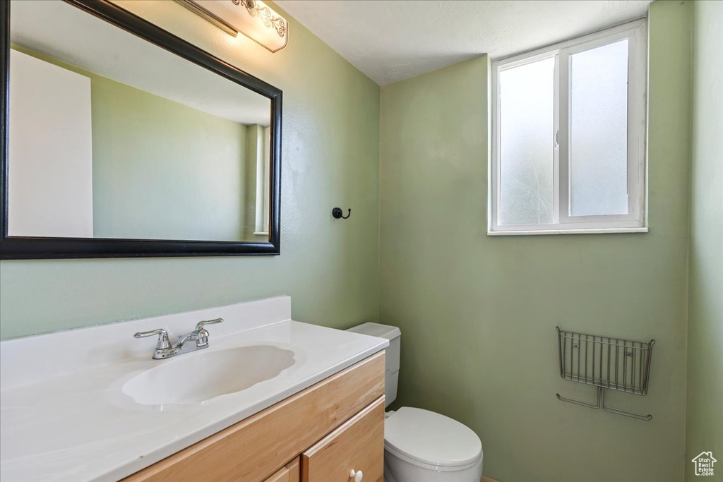 Half bath with plenty of natural light and vanity