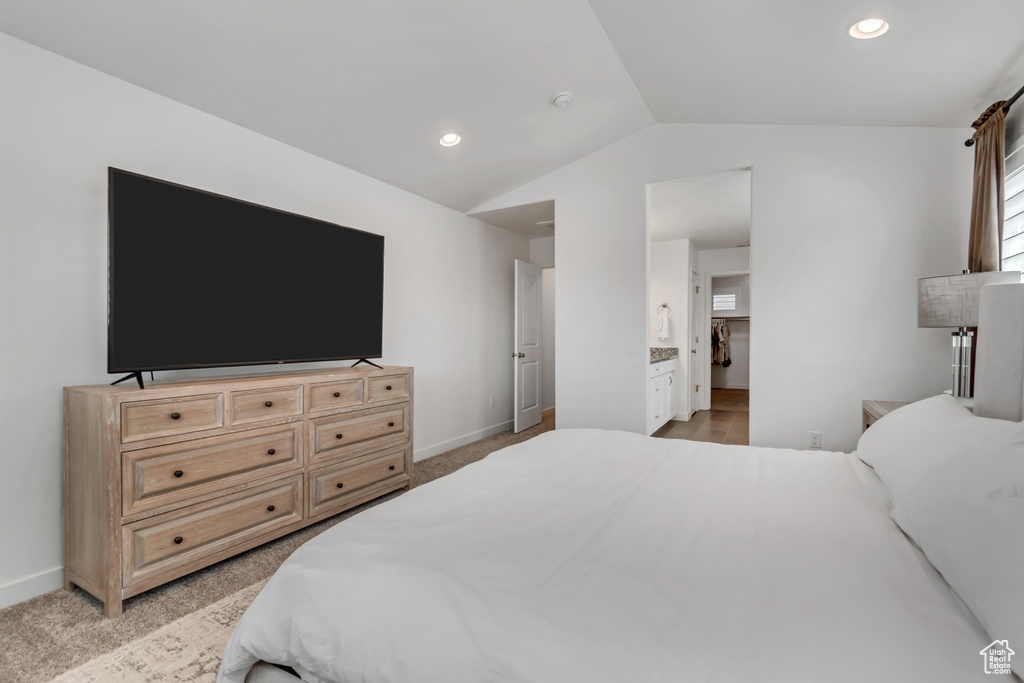 Bedroom featuring lofted ceiling and recessed lighting