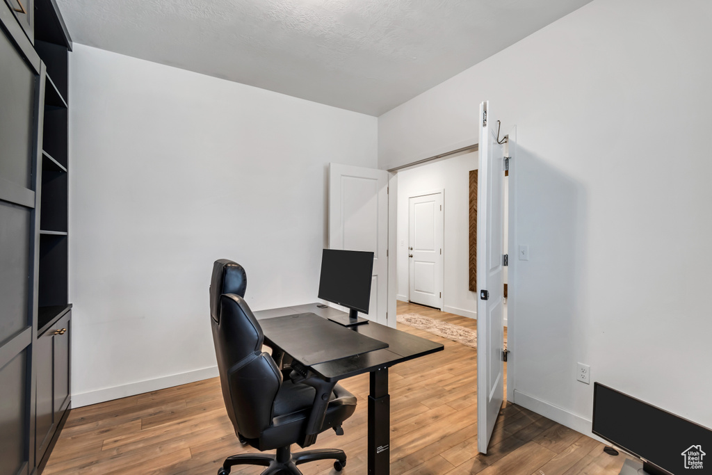 Office area featuring wood finished floors