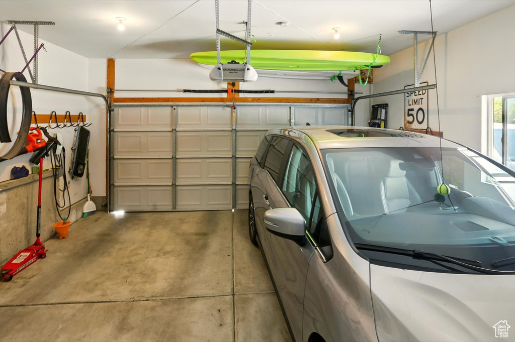Garage featuring a garage door opener