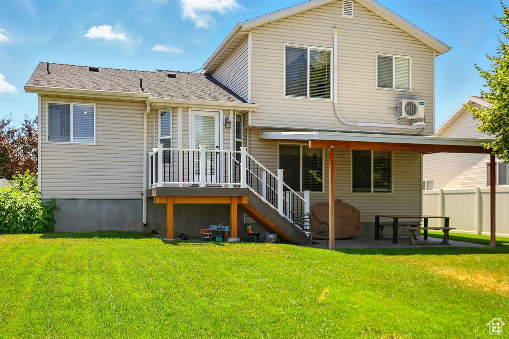 Rear view of property featuring a patio area