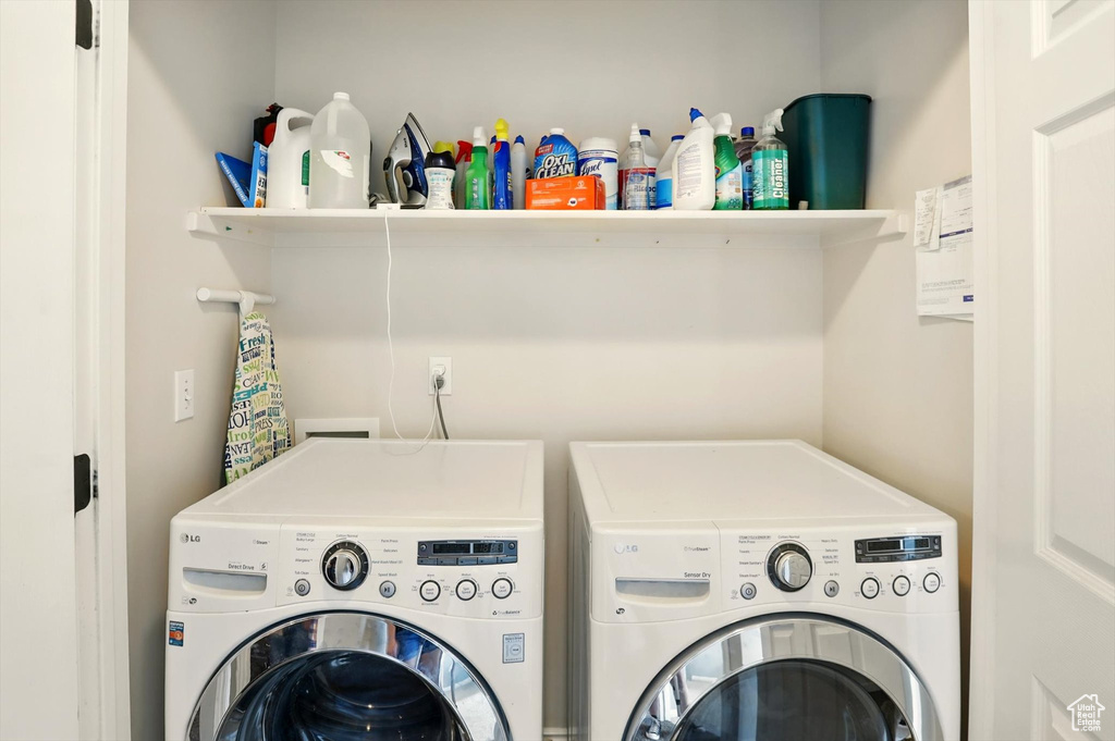Laundry area with washer and clothes dryer