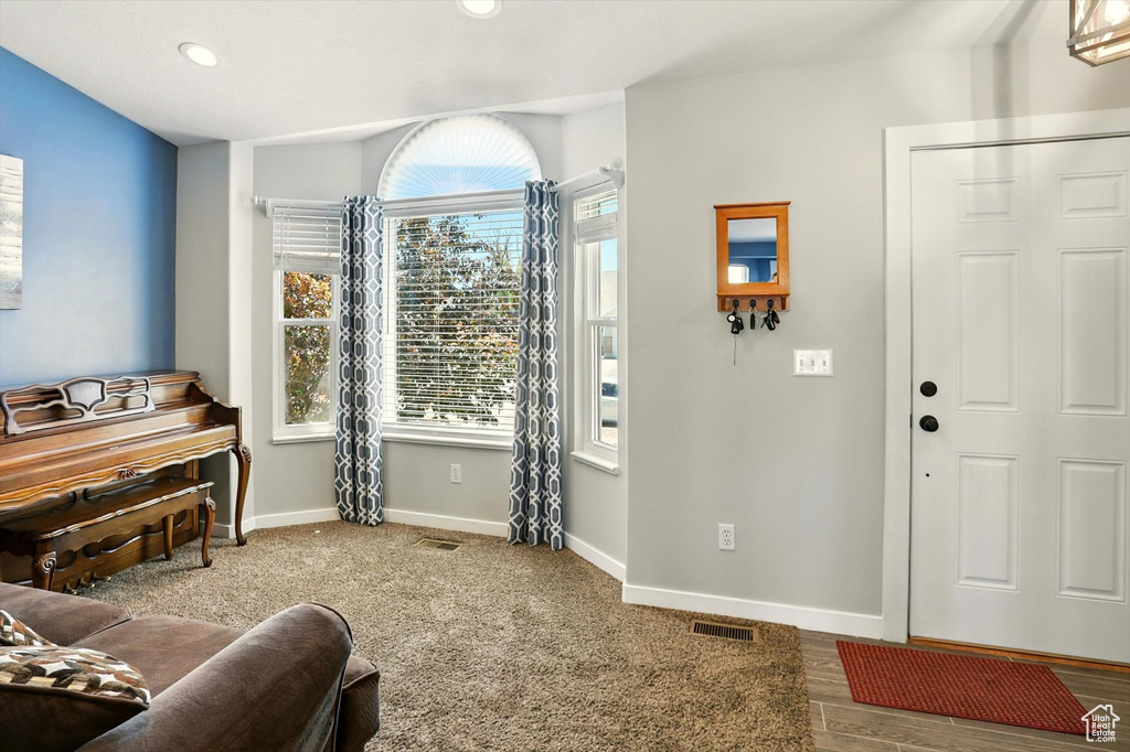 Living area featuring baseboards and recessed lighting