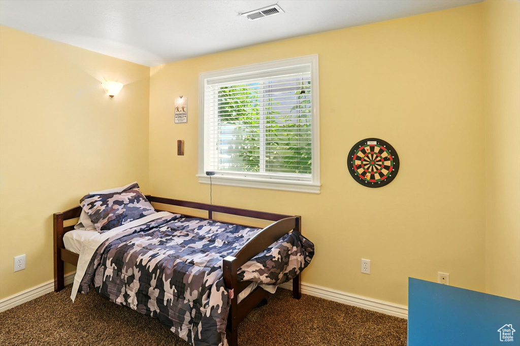 Carpeted bedroom with baseboards