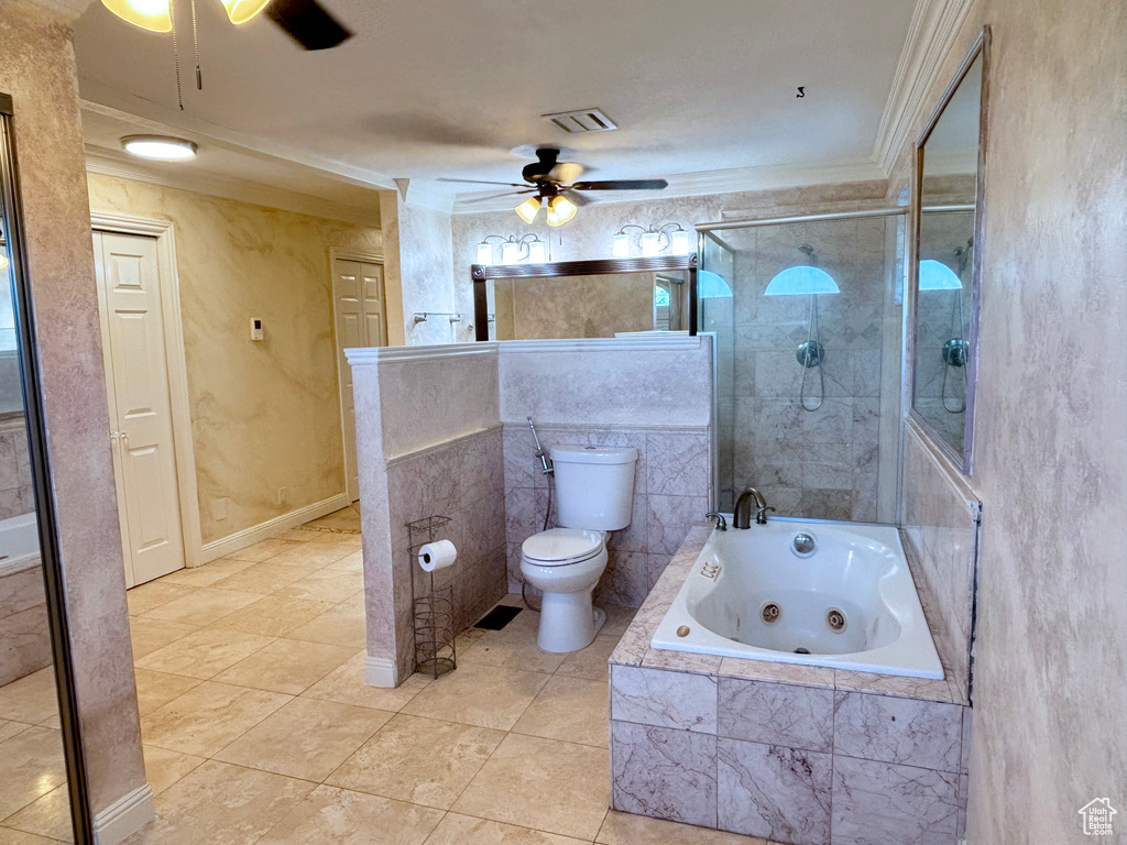 Bathroom with a ceiling fan, a tub with jets, crown molding, tiled shower, and tile patterned floors