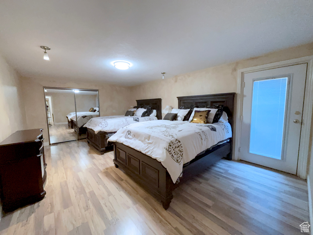Bedroom with light wood-style flooring