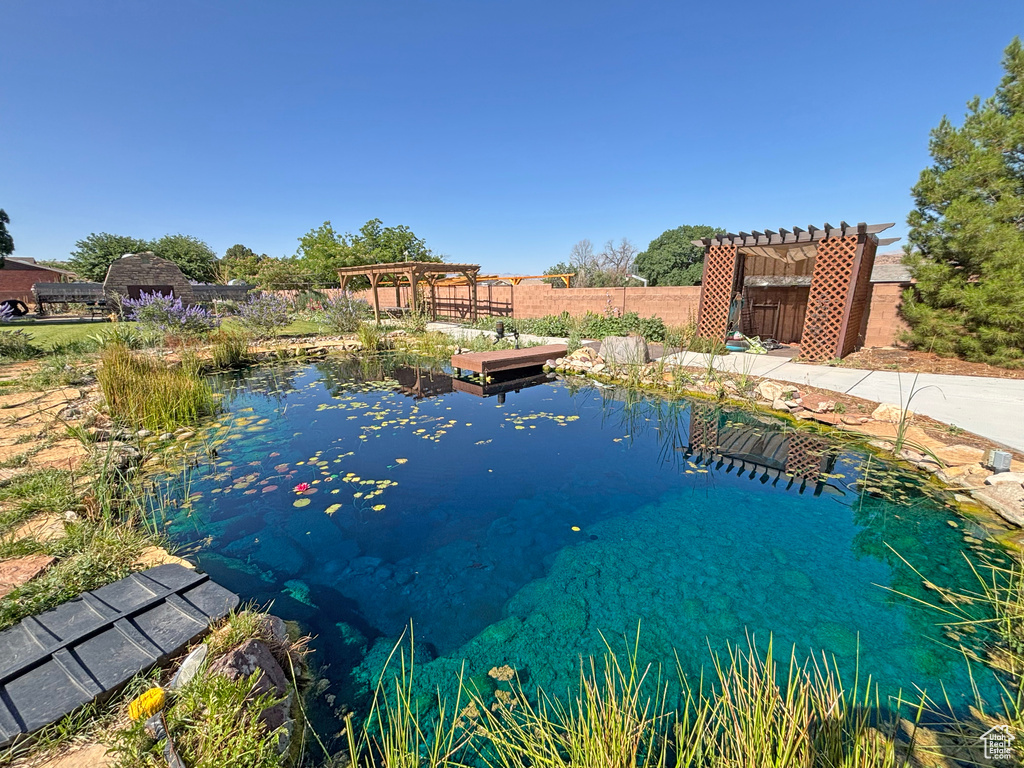 Water view with a garden pond