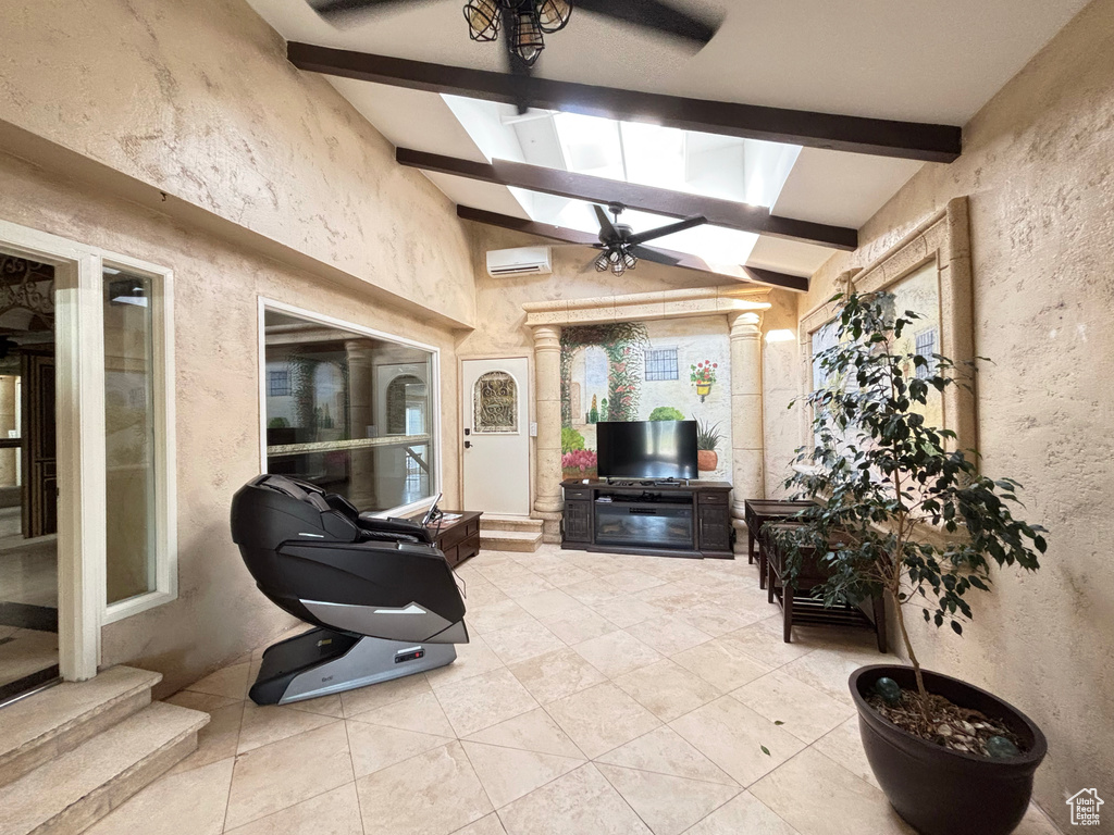 View of patio with an AC wall unit and ceiling fan