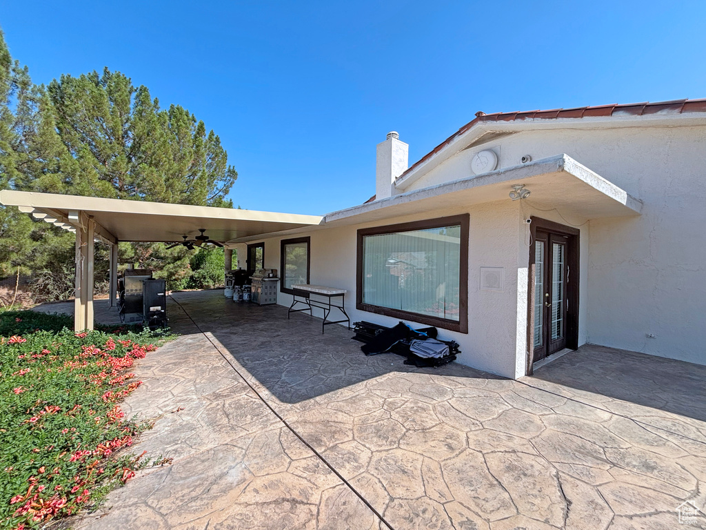 View of patio / terrace featuring ceiling fan and french doors