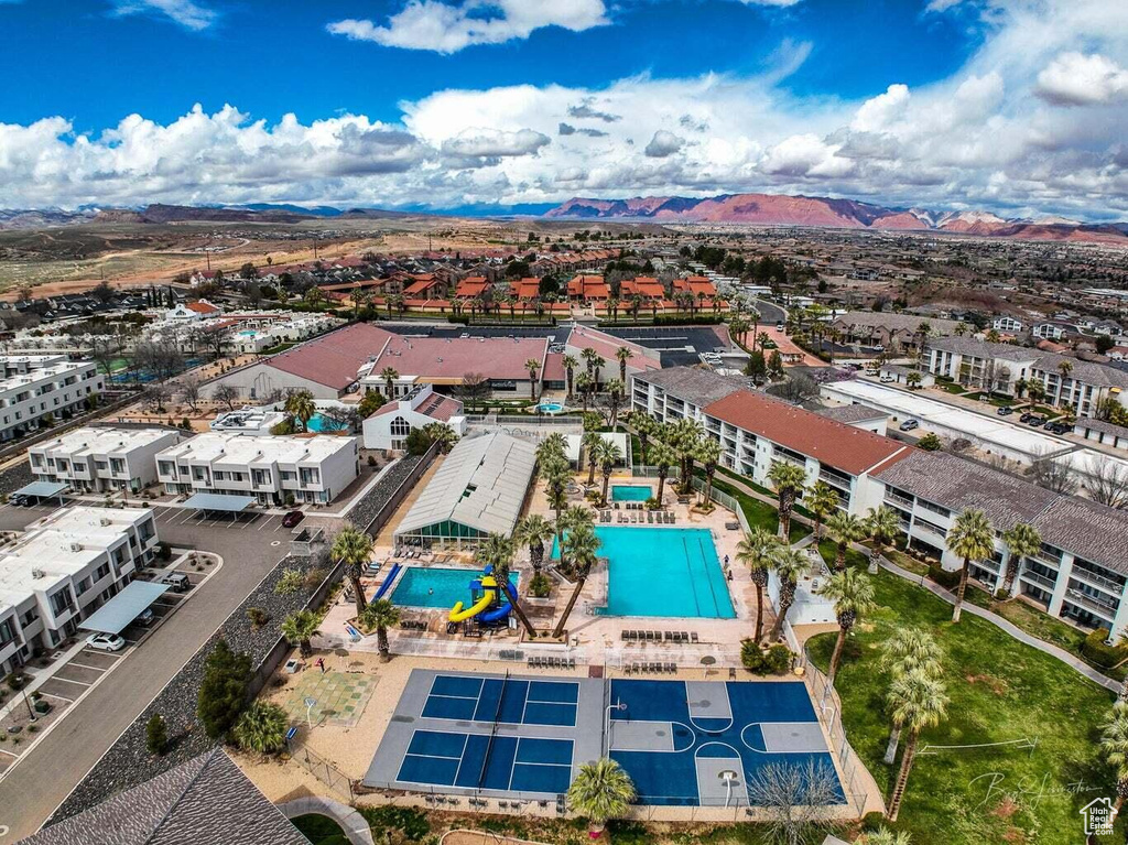 Drone / aerial view of a pool area and mountains