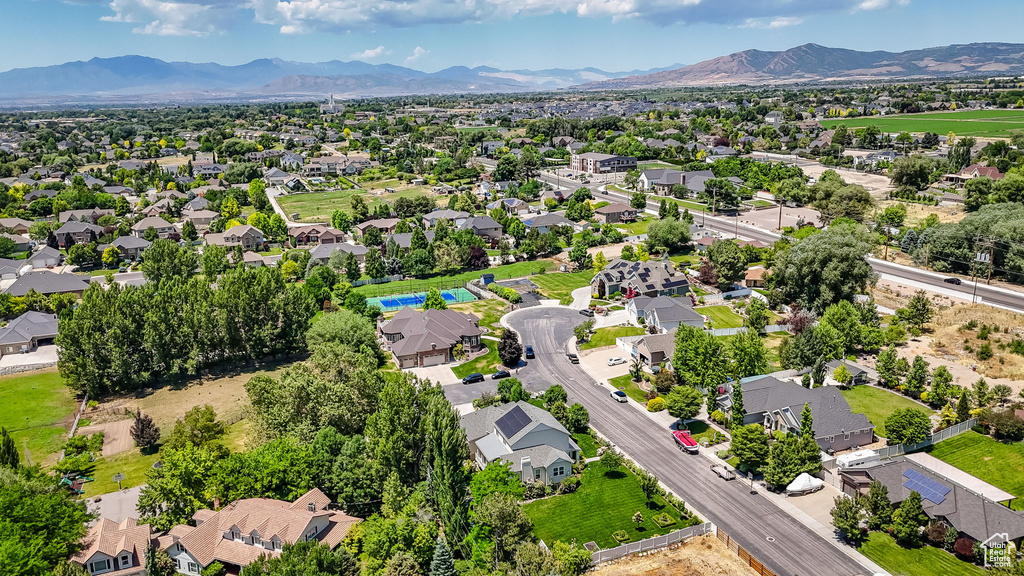 Aerial view of residential area featuring mountains