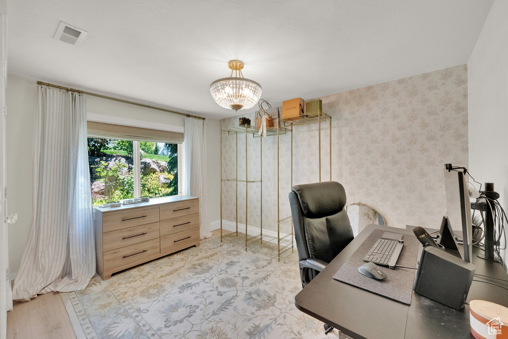 Office with a chandelier and baseboards