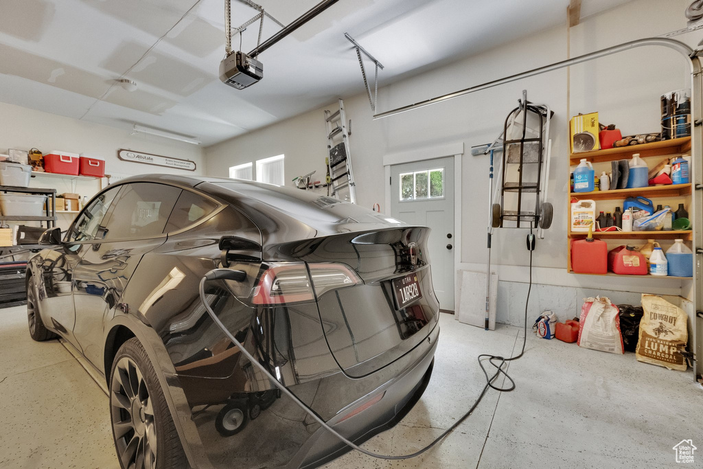 Garage featuring a garage door opener